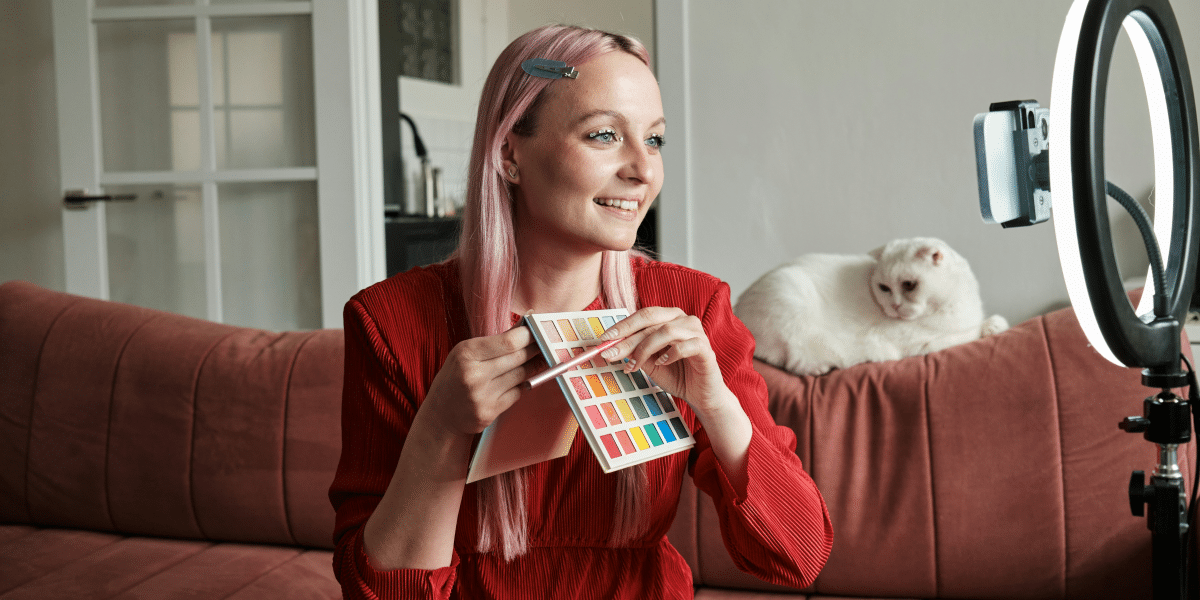 woman showing her make up tools in front of the camera